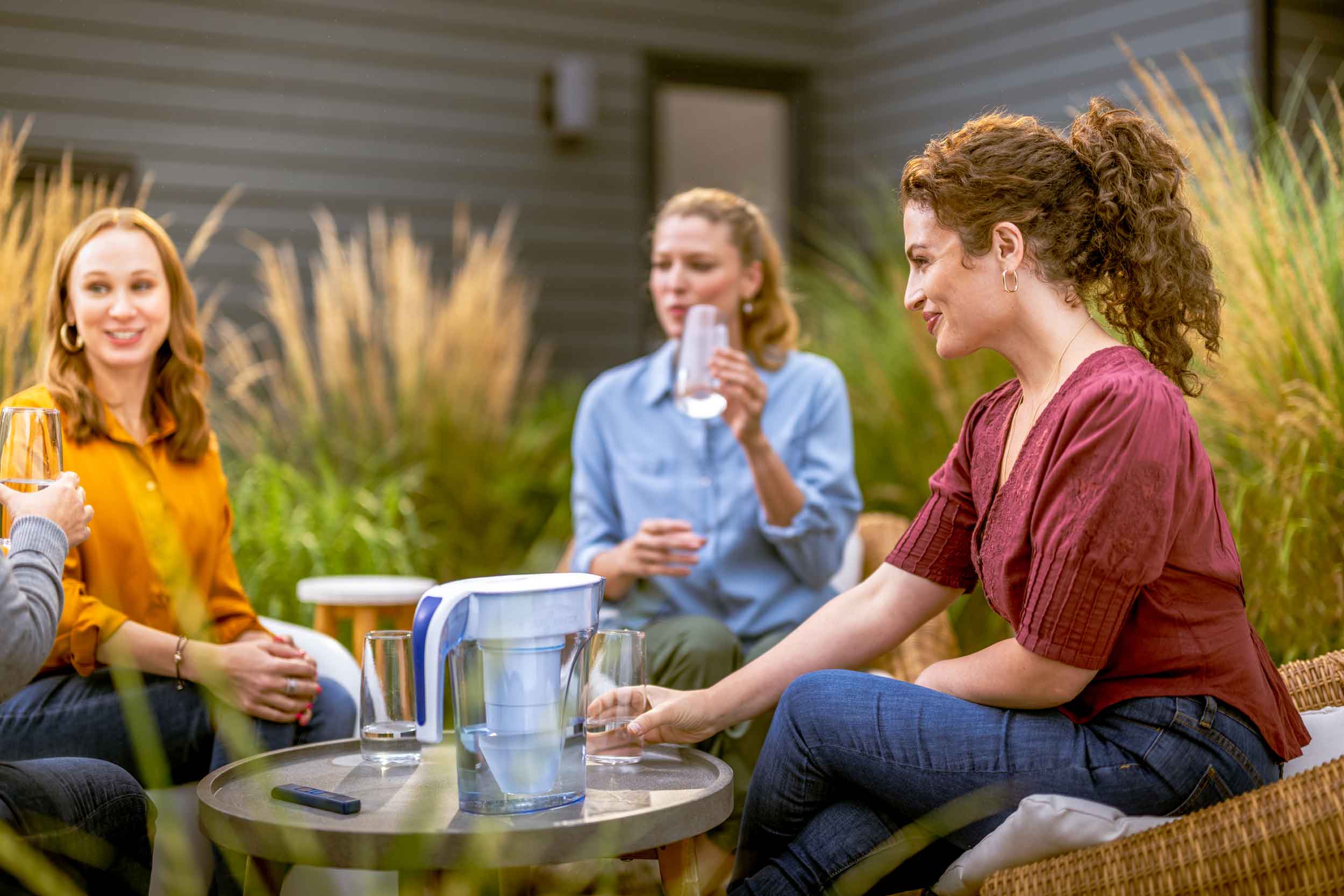 Filtered Drinking Water, Culligan Water Seymour Indiana Group of people sitting at a table drinking filtered water outside.